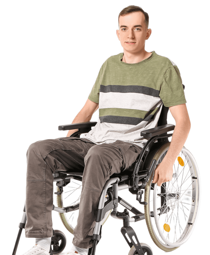 A young man sitting in a wheelchair.
